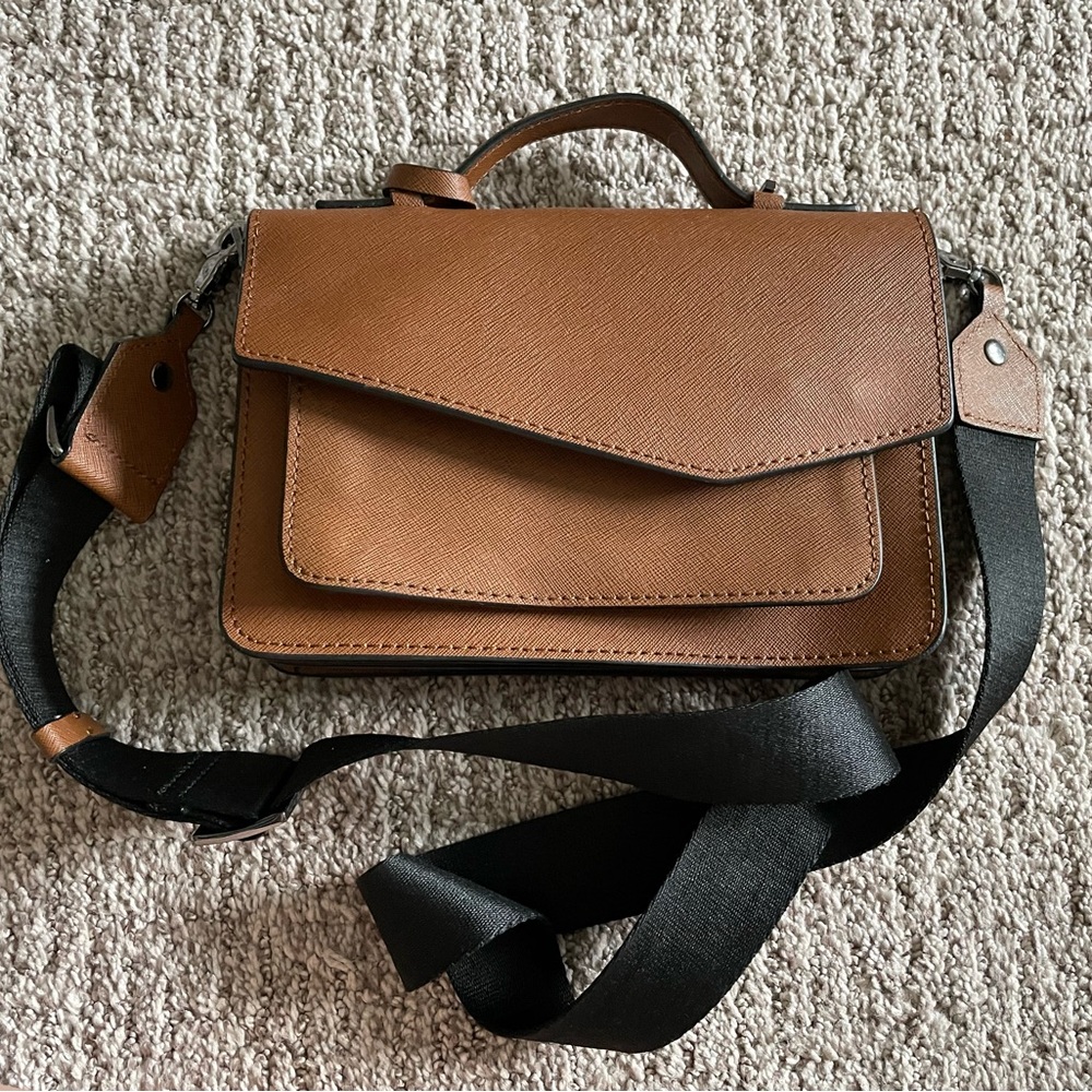 Tan and black Botkier crossbody bag.